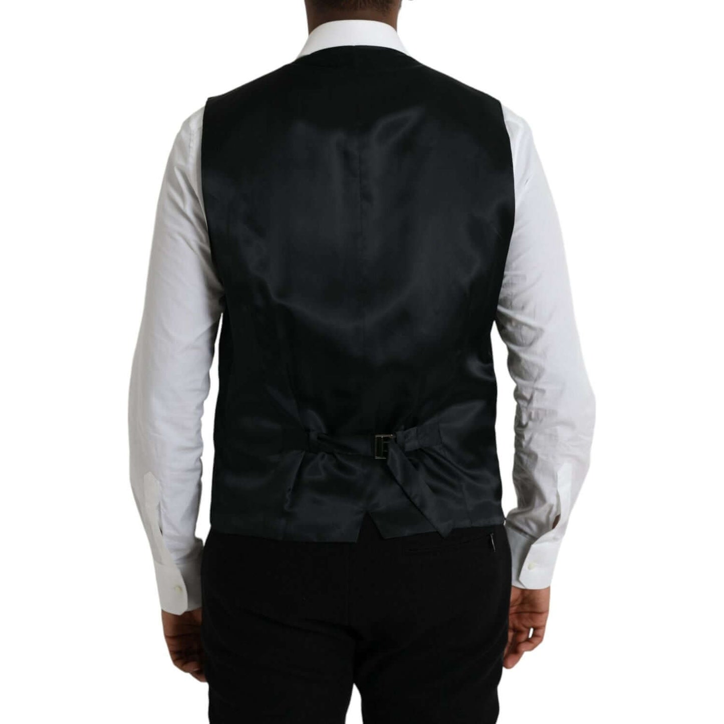 Back view of Dolce & Gabbana black wool waistcoat dress with adjustable strap, showing formal vest style in black fabric.
