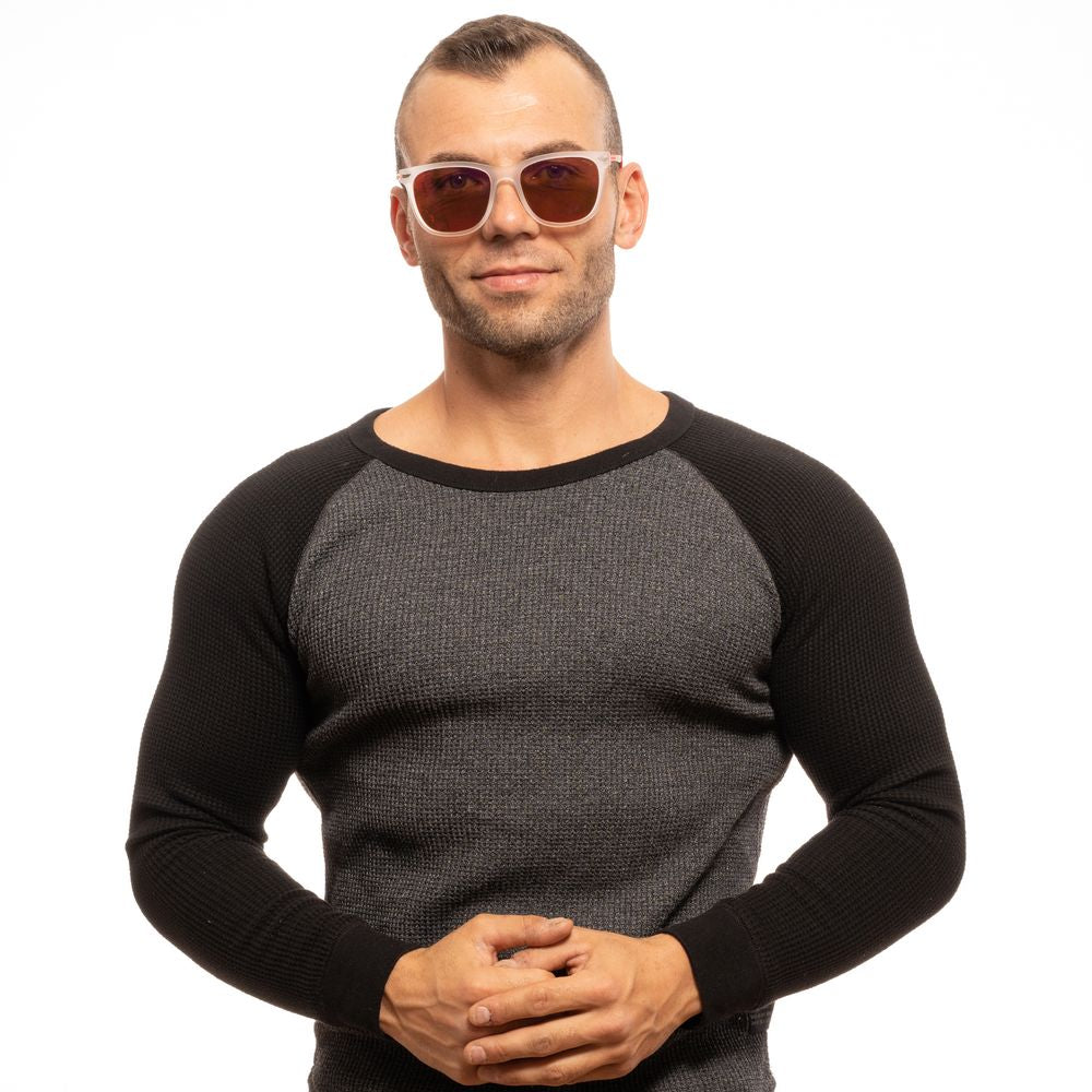 Man wearing Police Transparent Men Sunglasses with multicolor lenses, polarized effect, transparent plastic frame, outdoors.
