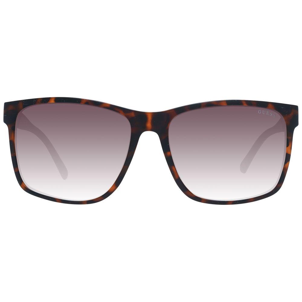 Guess brown men's sunglasses with square plastic frame and gradient lenses, offering 100% UVA & UVB protection. Style: Full-Rim.