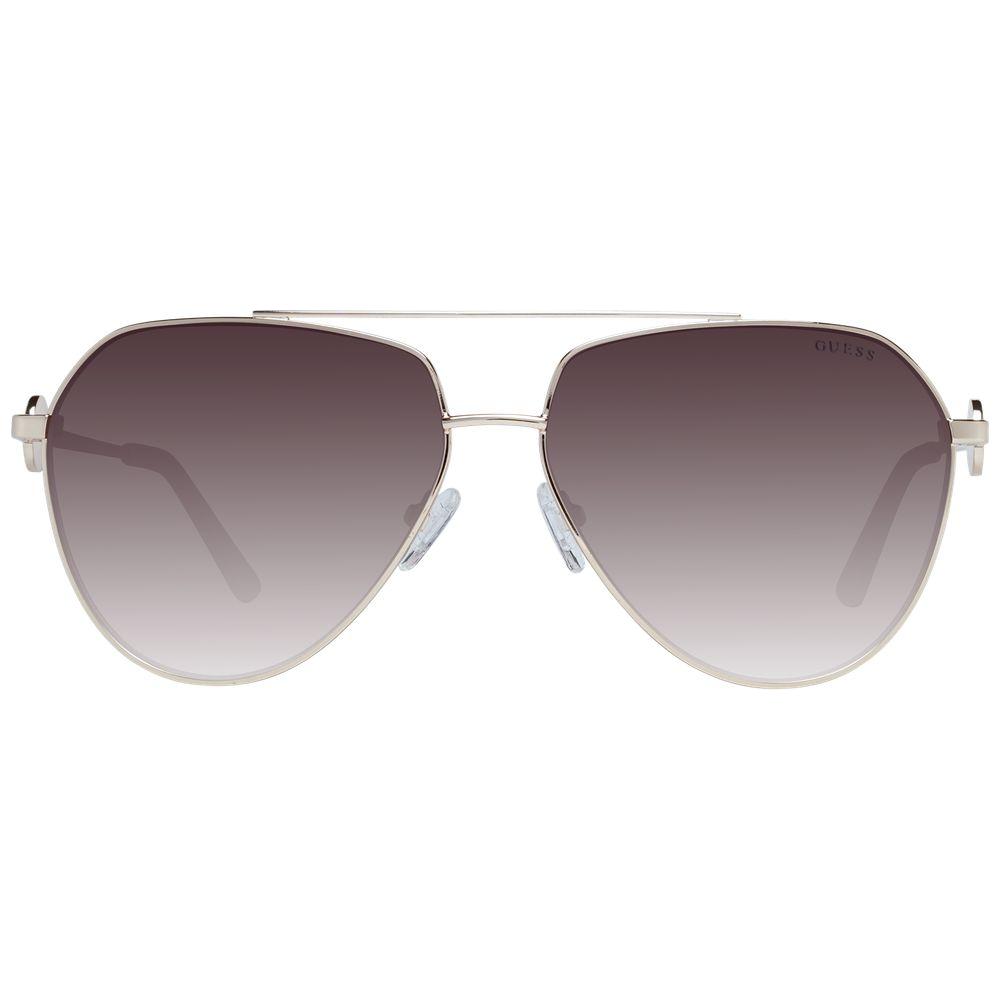 Guess gold aviator women's sunglasses with brown gradient lenses and full-rim metal frame. Offers 100% UVA & UVB protection.