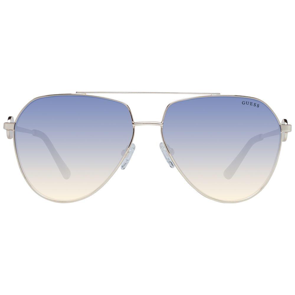 Gold metal frame aviator sunglasses for women with gradient blue lenses by Guess. Offers 100% UVA & UVB protection, full-rim design.