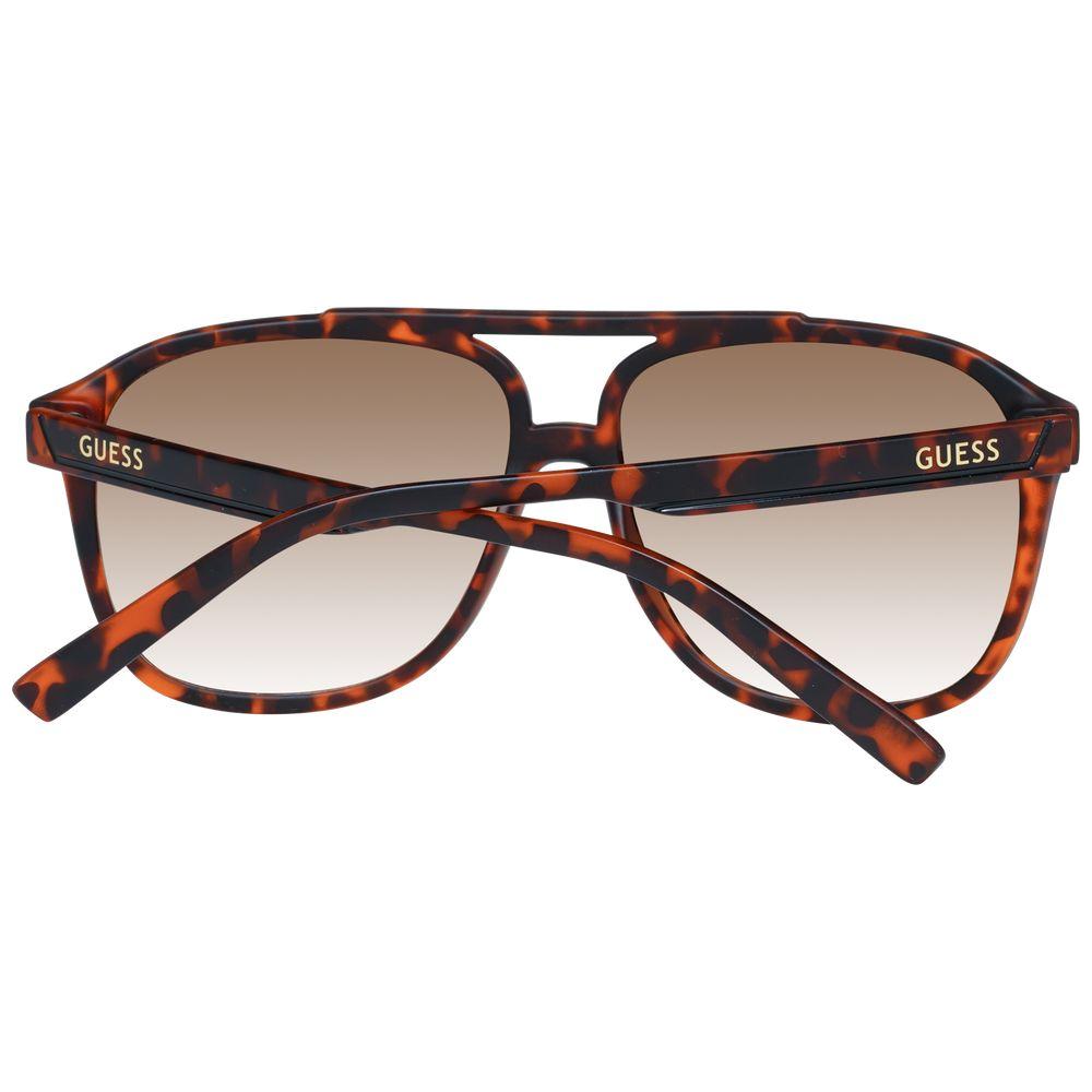 Guess brown men's sunglasses with full-rim aviator style, plastic frame, and gradient lenses. Includes branded case. 100% UV protection.