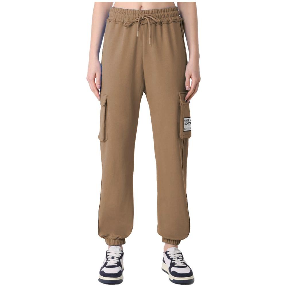Comme des Fuckdown brown fleece pants with front logo and cargo pockets, featuring drawstring waistband and solid color.