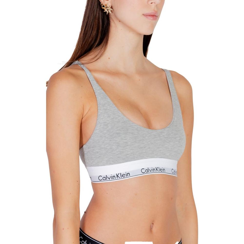 Calvin Klein gray cotton bralette, lightly lined for comfort, featuring a minimalist design ideal for everyday wear.