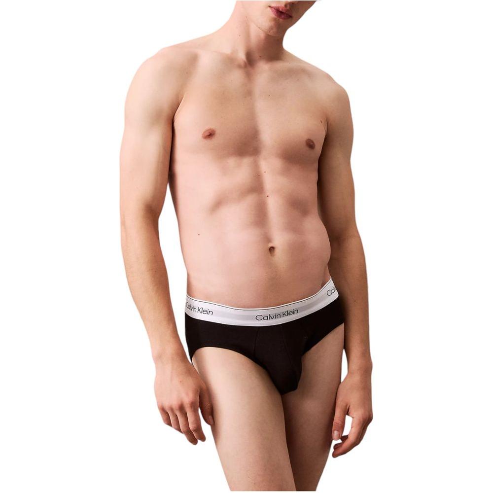 Model wearing Calvin Klein gray cotton underwear with logo waistband, highlighting comfort and fit