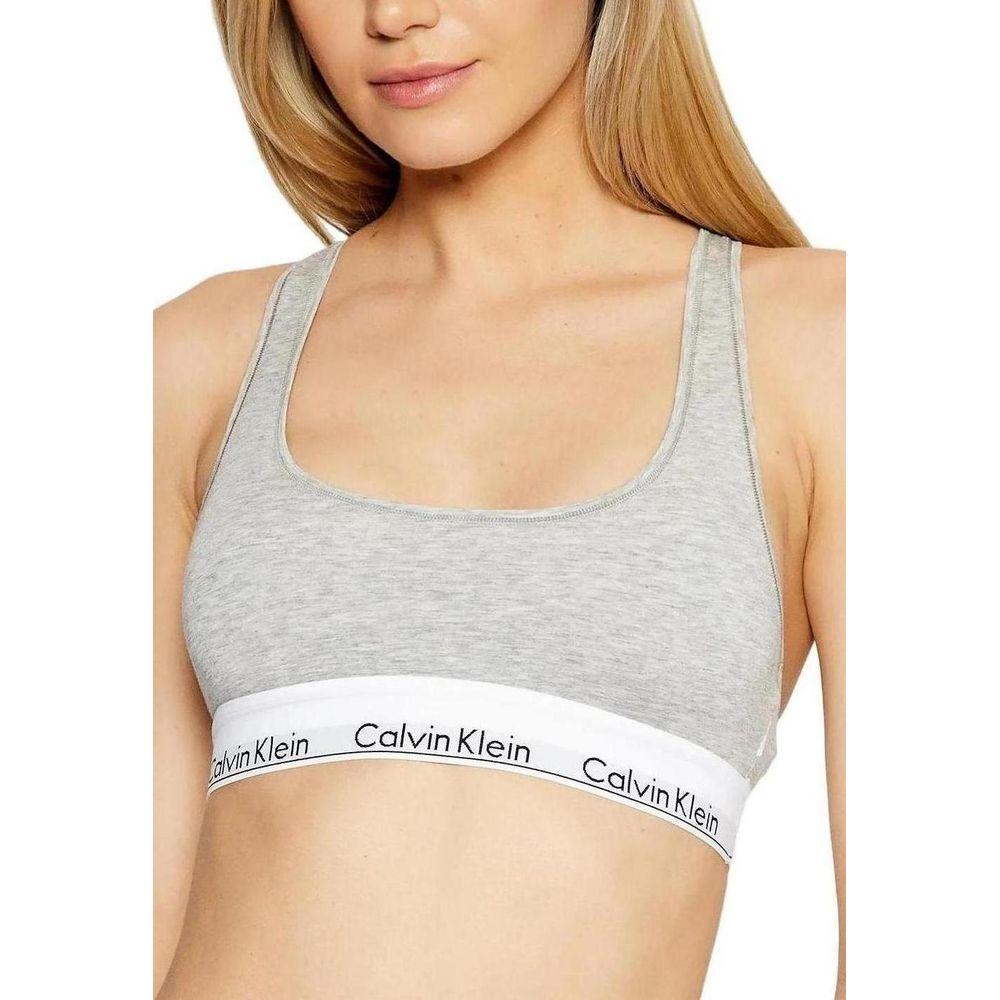Calvin Klein gray cotton women's bra with elastic band, minimalist design for comfort and support, featuring brand logo.