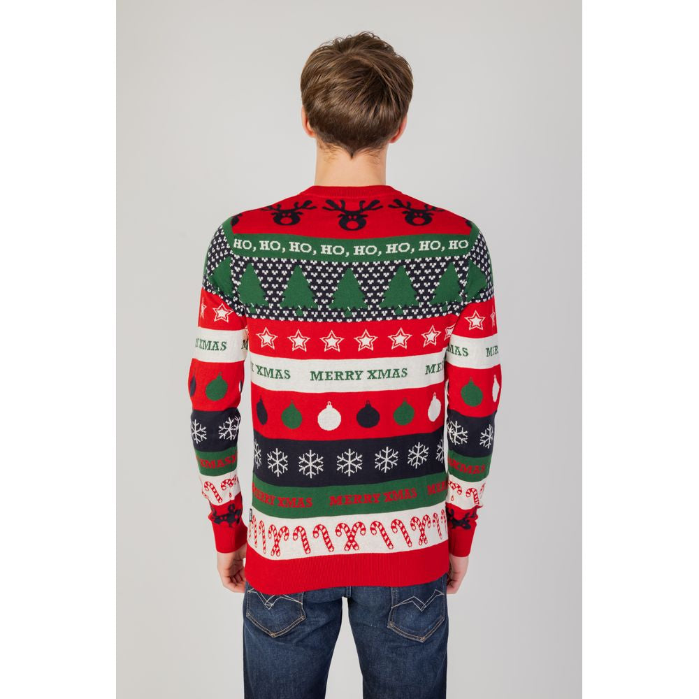 Back view of a man wearing a festive Christmas sweater with holiday patterns and text, paired with blue jeans.