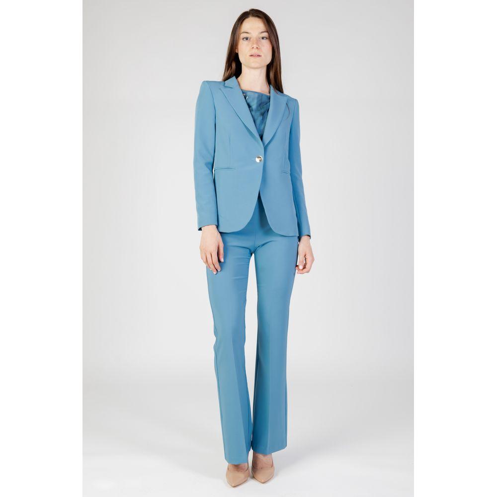 Woman wearing Rinascimento turquoise polyester suit and blazer for autumn/winter collection