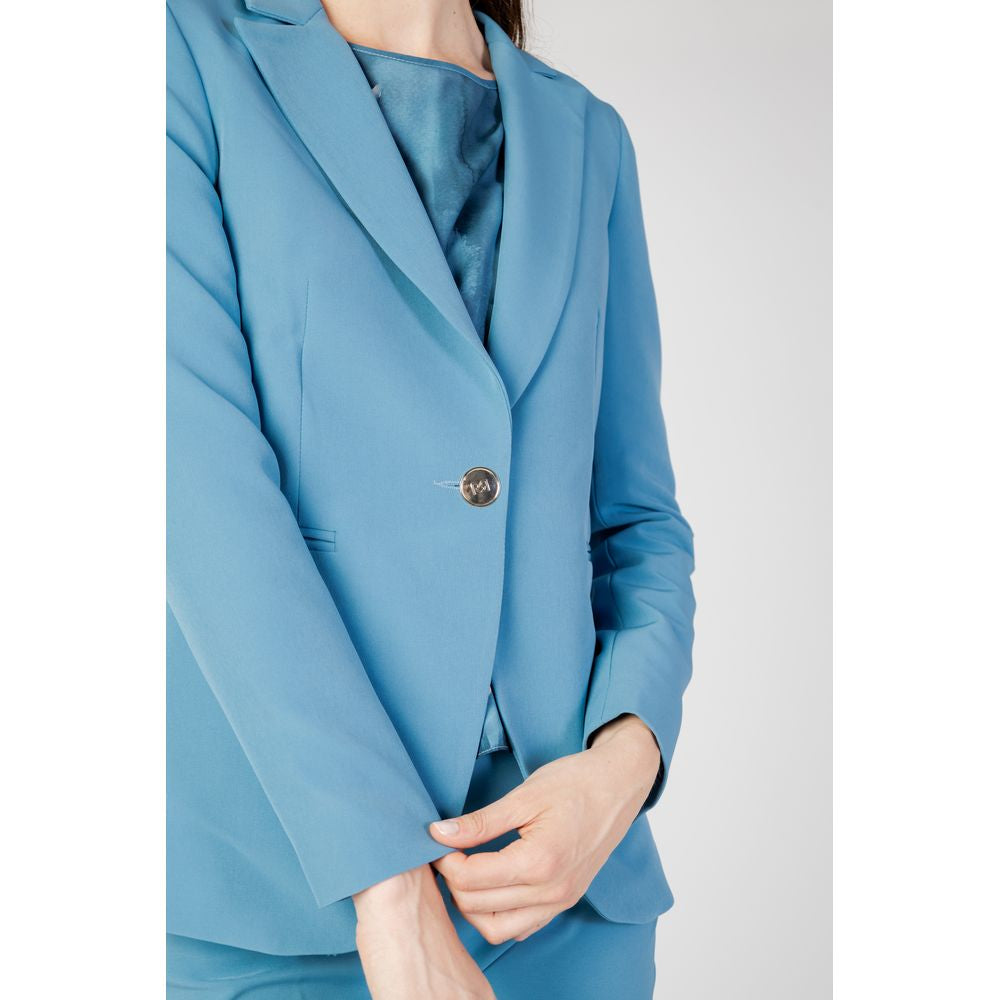 Woman wearing Rinascimento turquoise polyester blazer, part of the Autumn/Winter collection, showcasing elegant design.