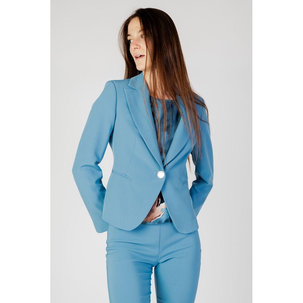 Woman wearing Rinascimento turquoise autumn/winter blazer and suit, 100% polyester, elegant women's fashion.