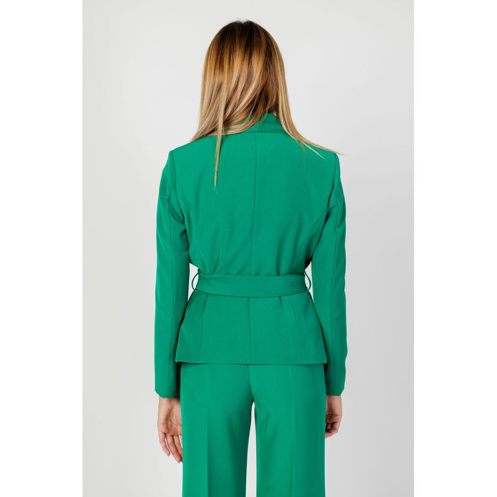 Back view of a woman wearing Sandro Ferrone green polyester suit with blazer, part of the Autumn/Winter collection.
