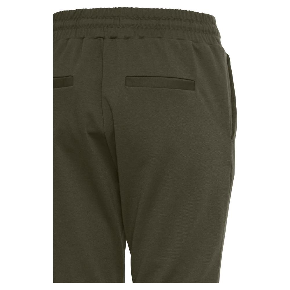Back view of ICHI green polyester women's cigarette pants, fall/winter collection, elastic waist, comfortable fit.