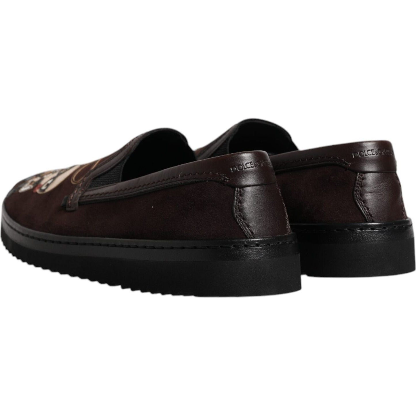Back view of Dolce & Gabbana brown suede loafers, featuring rubber sole and logo details. Made in Italy, moccasin style elegance.
