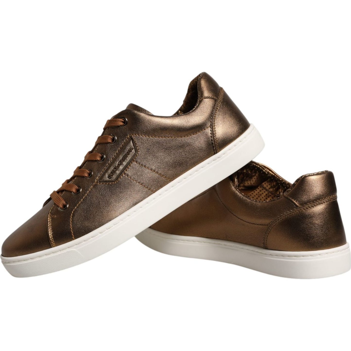 Dolce & Gabbana gold metallic leather sneakers with white rubber sole and lace-up closure, featuring logo details, made in Italy