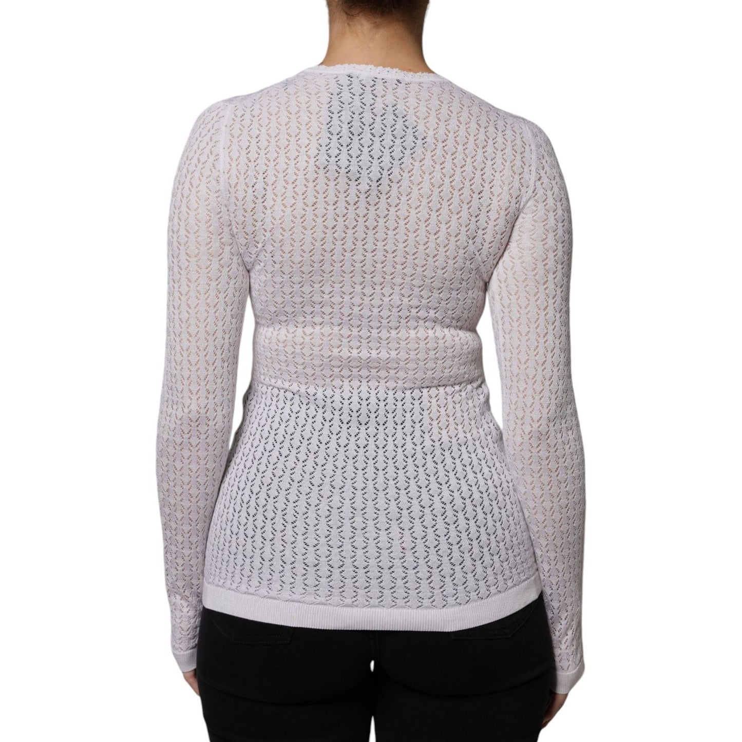 Back view of Dolce & Gabbana white silk button down cardigan sweater, showcasing intricate knit design, long sleeves, and lightweight fabric.