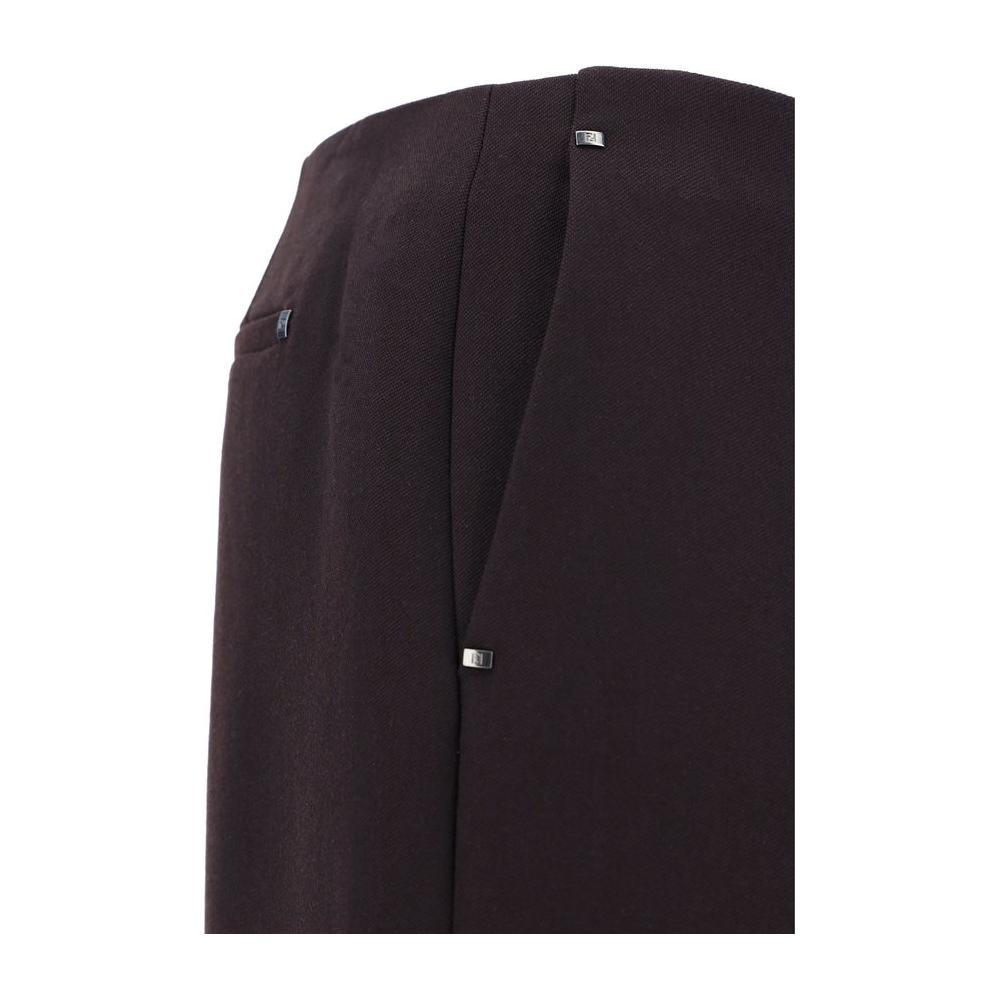 Close-up of Fendi Virgin Wool Pants with button and zipper closure, showcasing side slash pockets and elegant design.