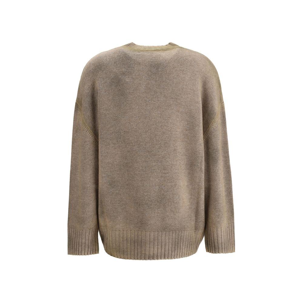 The Attico wool sweater with ribbed neck and cuffs, asymmetrical hem, and iconic logo, showcasing a loose fit in monochrome pattern.