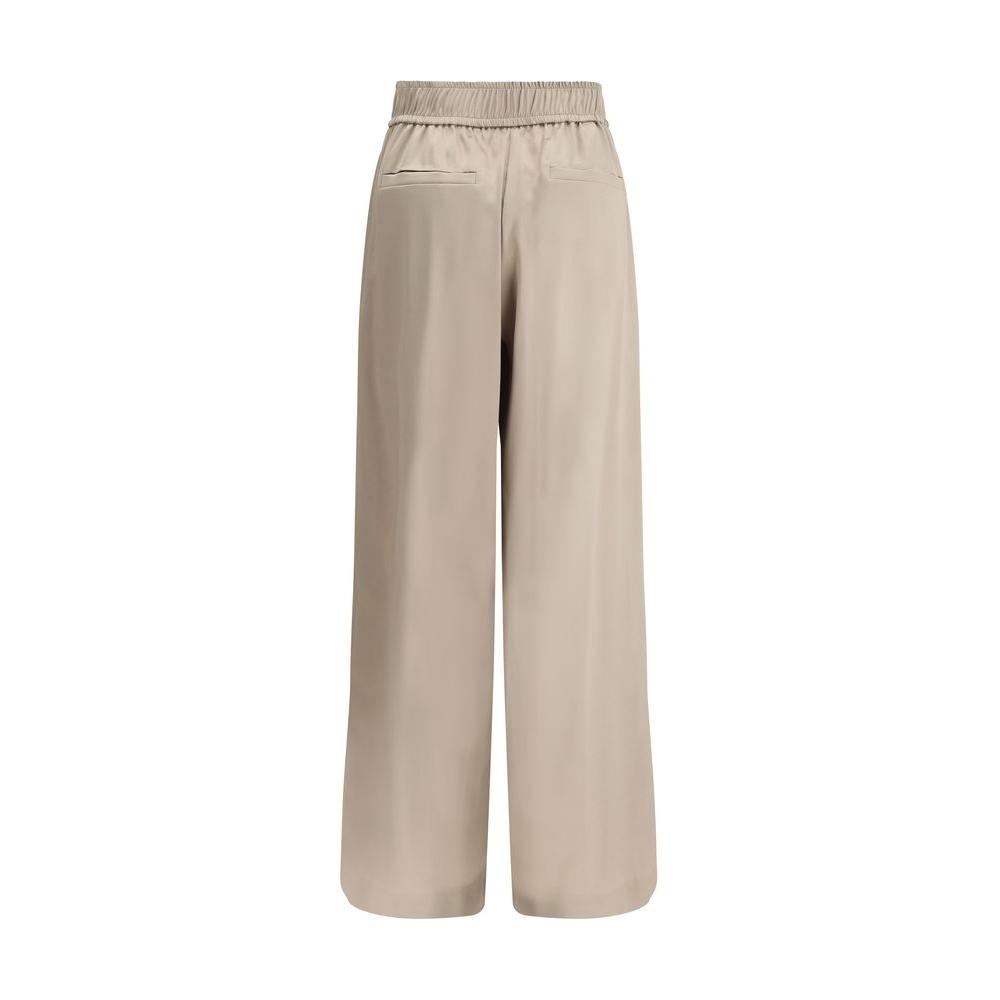 Brunello Cucinelli silk palazzo pants with elastic waistband and back welt pockets, beige color, elegant and comfortable design.