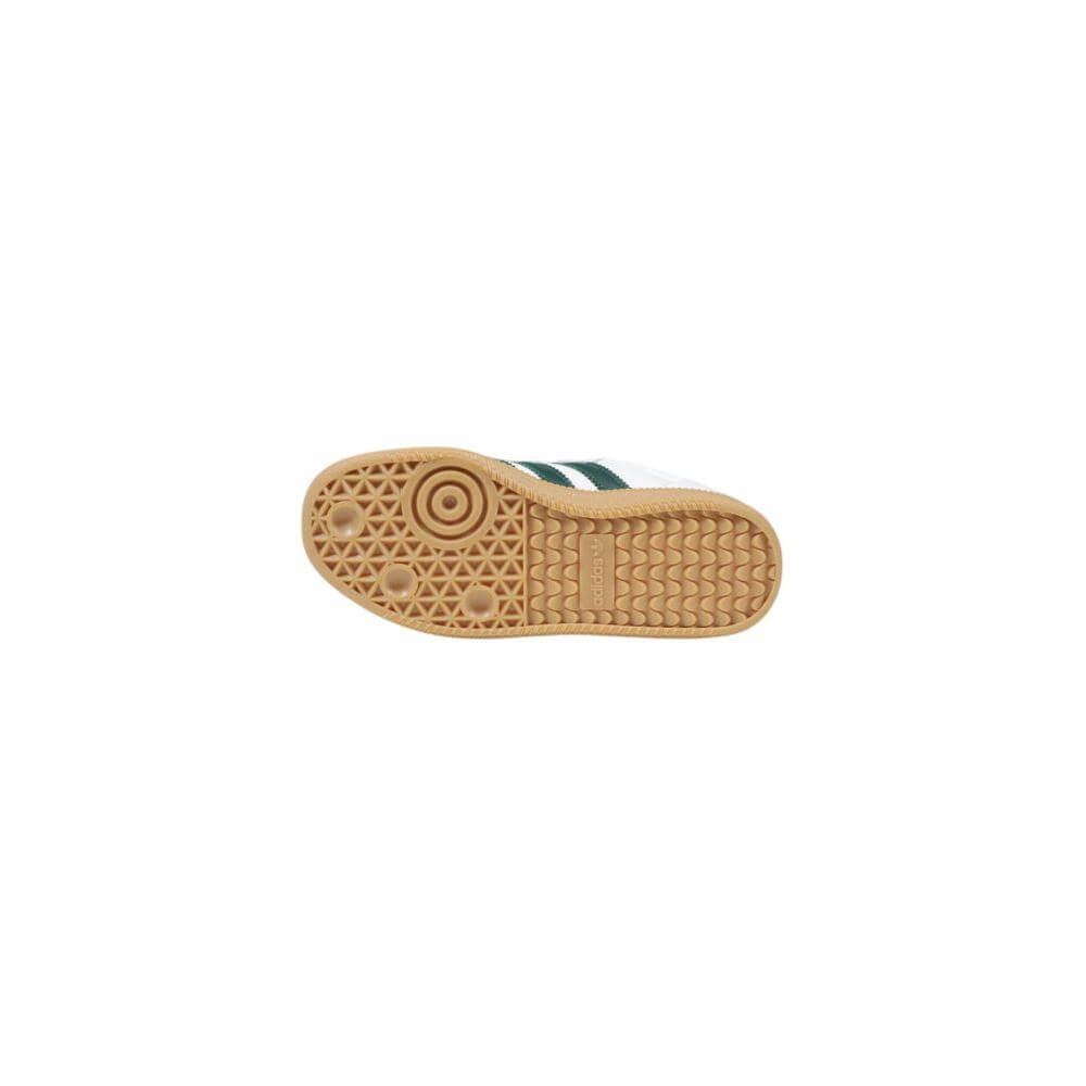 Sole view of Adidas white leather men's sneaker, fall/winter collection, with textured pattern for grip.