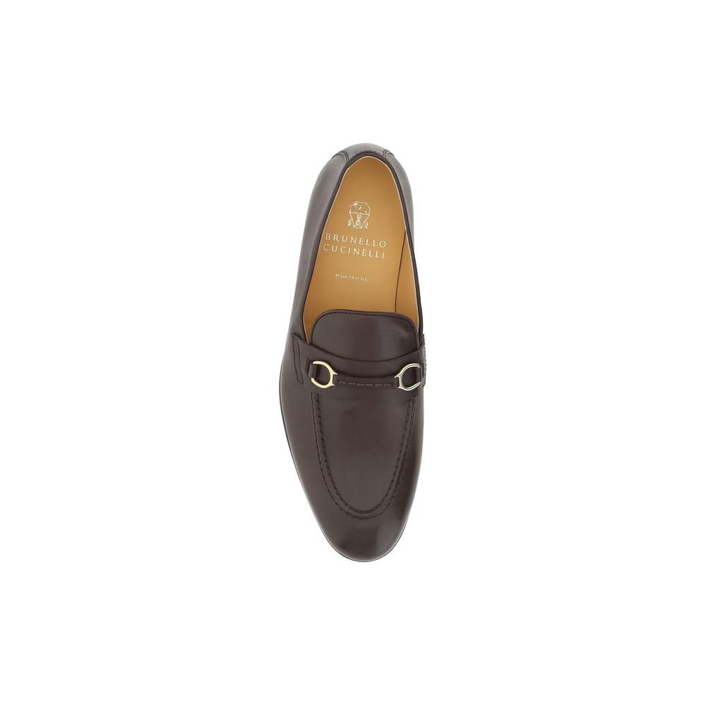 Brunello Cucinelli leather loafers with almond toe and antiqued brass detail, featuring a press-stamped logo insole.