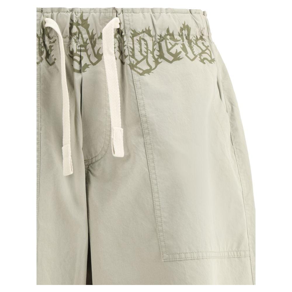 Palm Angels cotton waist pants with elastic drawstring, wide-leg style, patch pockets, and iconic monogram.
