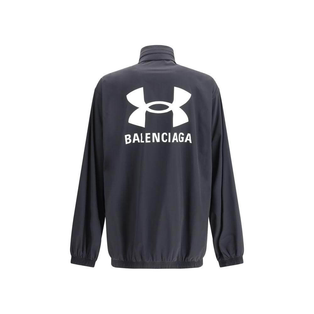 Alt Tag: Balenciaga jacket with front zipper, built-in hood, elasticized hem and sleeves, oversized fit, iconic brand monogram on back.