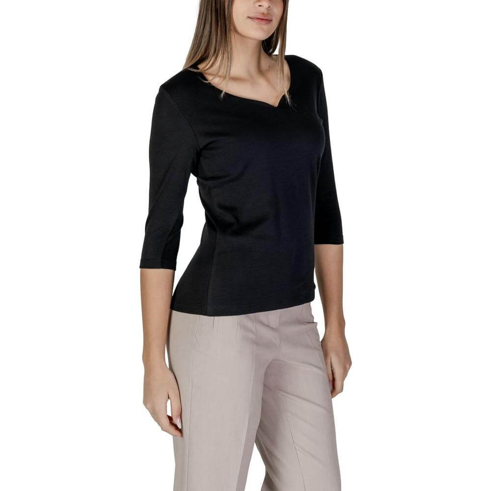 Woman wearing Street One black short-sleeved cotton modal t-shirt, spring/summer collection.