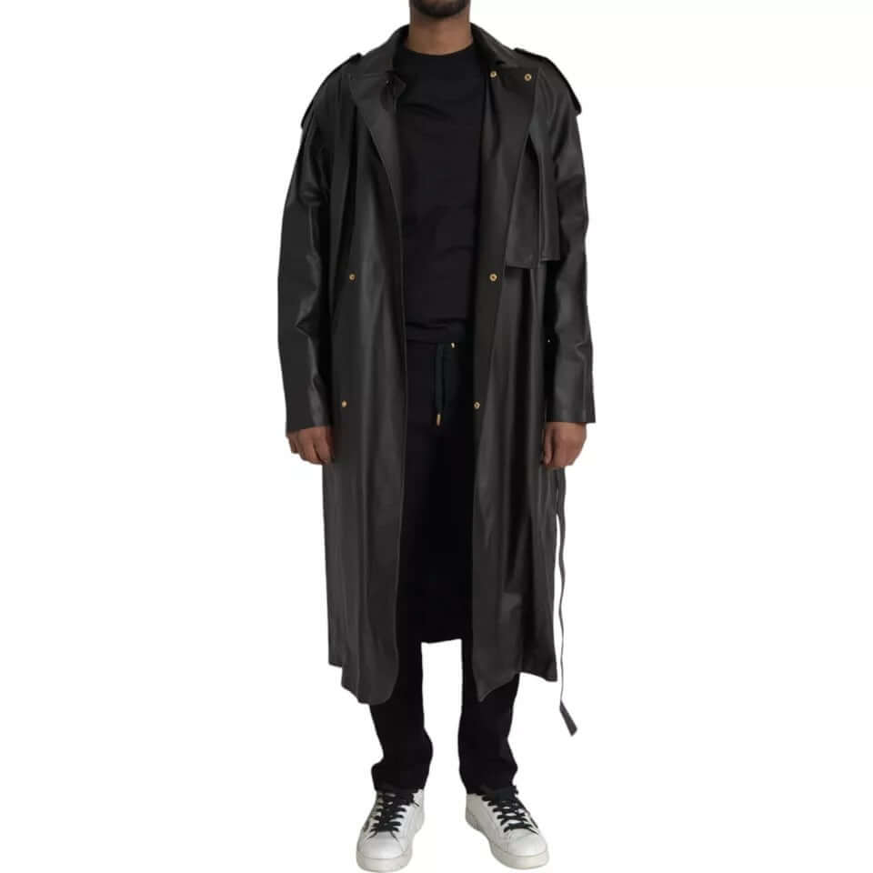 Bottega Veneta black leather men waterproof trench coat jacket with full button closure, made in Italy, worn with casual attire.