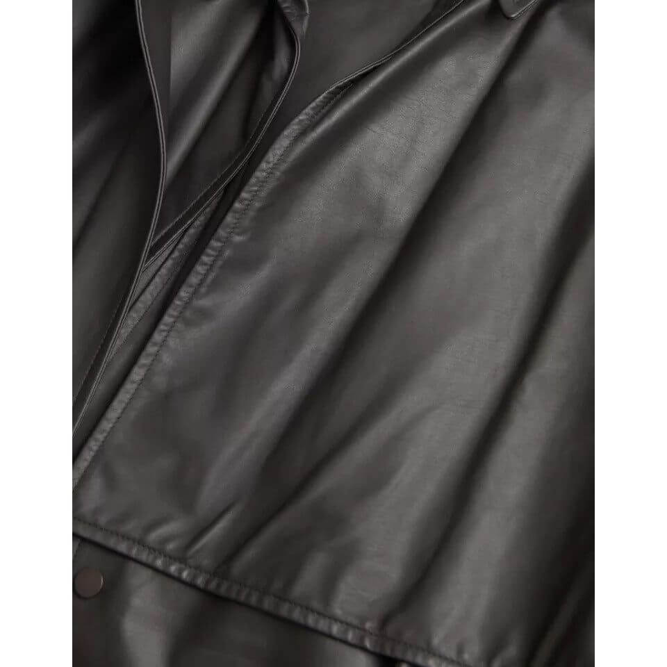 Bottega Veneta black leather waterproof trenchcoat jacket close-up, made in Italy, full button closure, 100% calf leather.