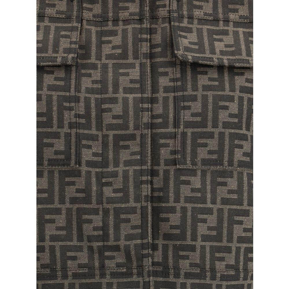 Close-up of Fendi FF logo cropped jacket in dark tones, featuring the iconic FF pattern with front patch pockets and snap closure.