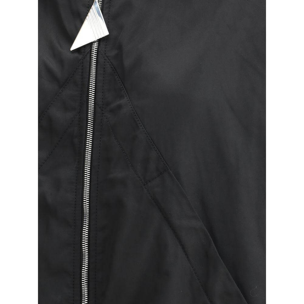 Close-up of The Attico Nylon Windbreaker Jacket's front zipper and fabric texture, showcasing its stylish and functional design.