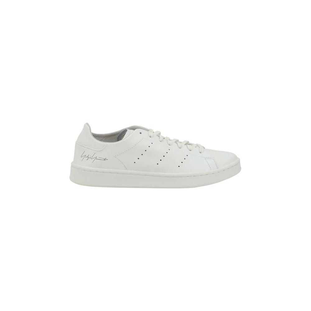 Y-3 Stan Smith Sneakers with leather finish, perforated panels, and Yohji Yamamoto signature on heel, featuring a flat sole and lace-up design.