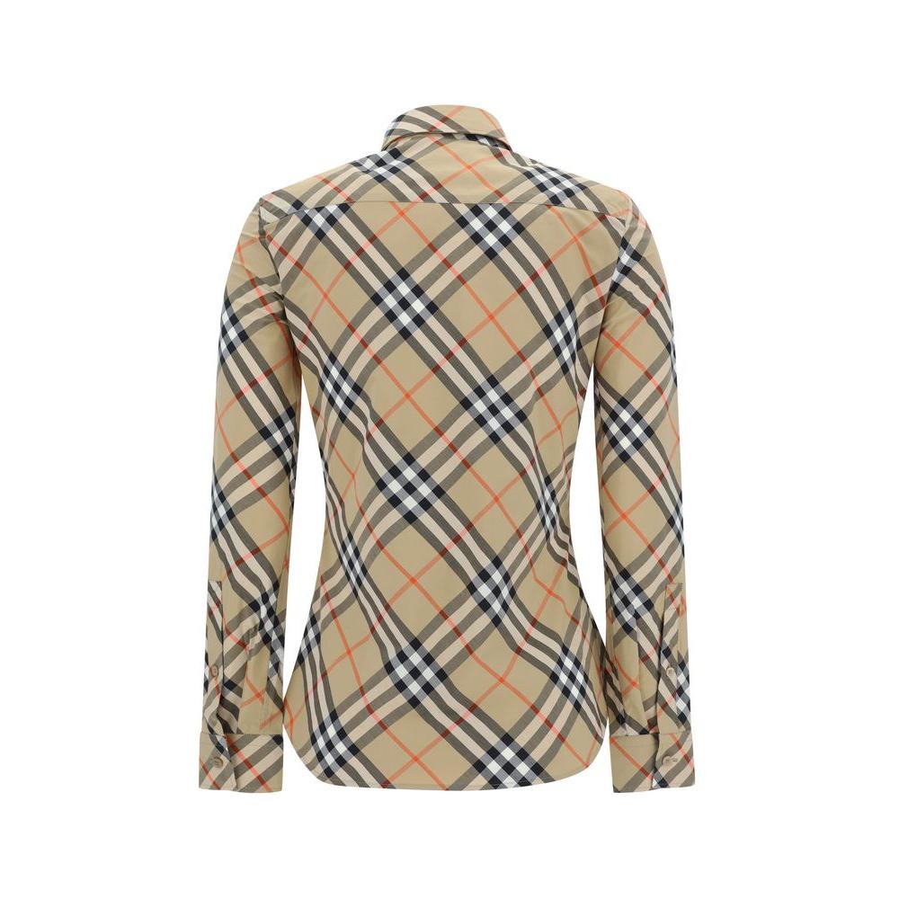 Burberry Archive Check Shirt showcasing iconic pattern, elegant collar, and flared hem for a timeless and refined style.