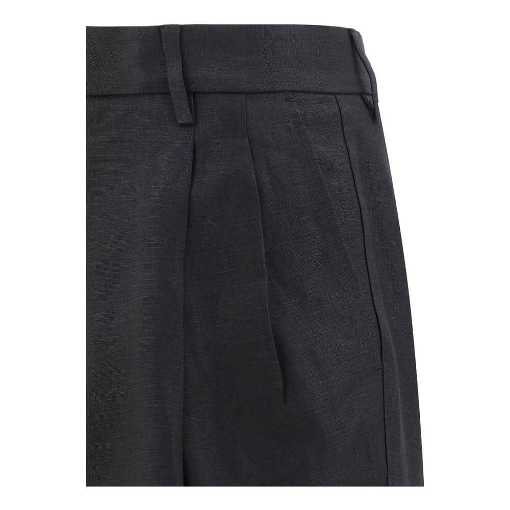 Close-up of Dolce & Gabbana linen pants with tailored design, featuring balloon leg style and front zipper closure for a perfect fit.