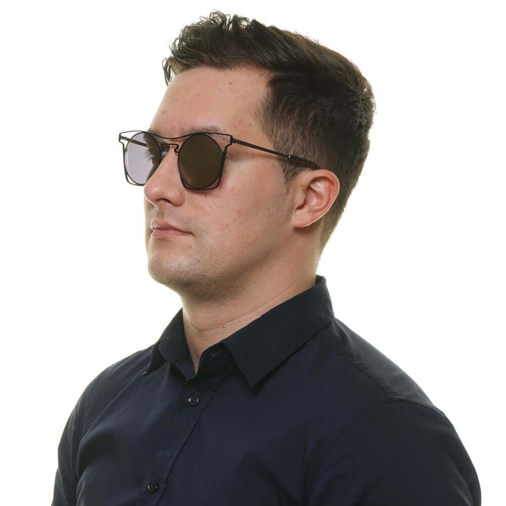 Man wearing Yohji Yamamoto black metal frame sunglasses with grey mirrored round lenses, offering 100% UVA & UVB protection.