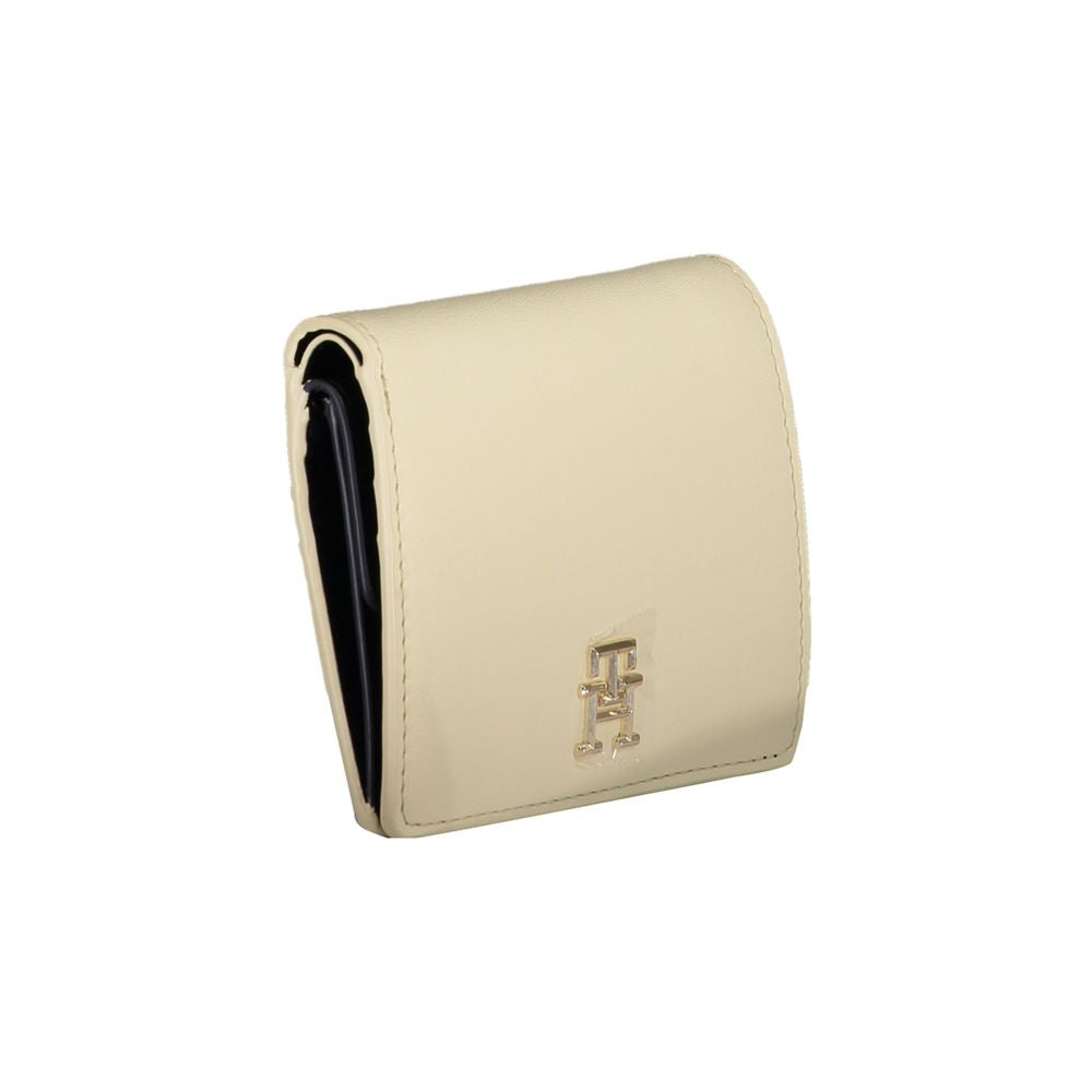 Tommy Hilfiger beige polyethylene wallet with logo, snap closure, external card pockets, coin purse, and card spaces.