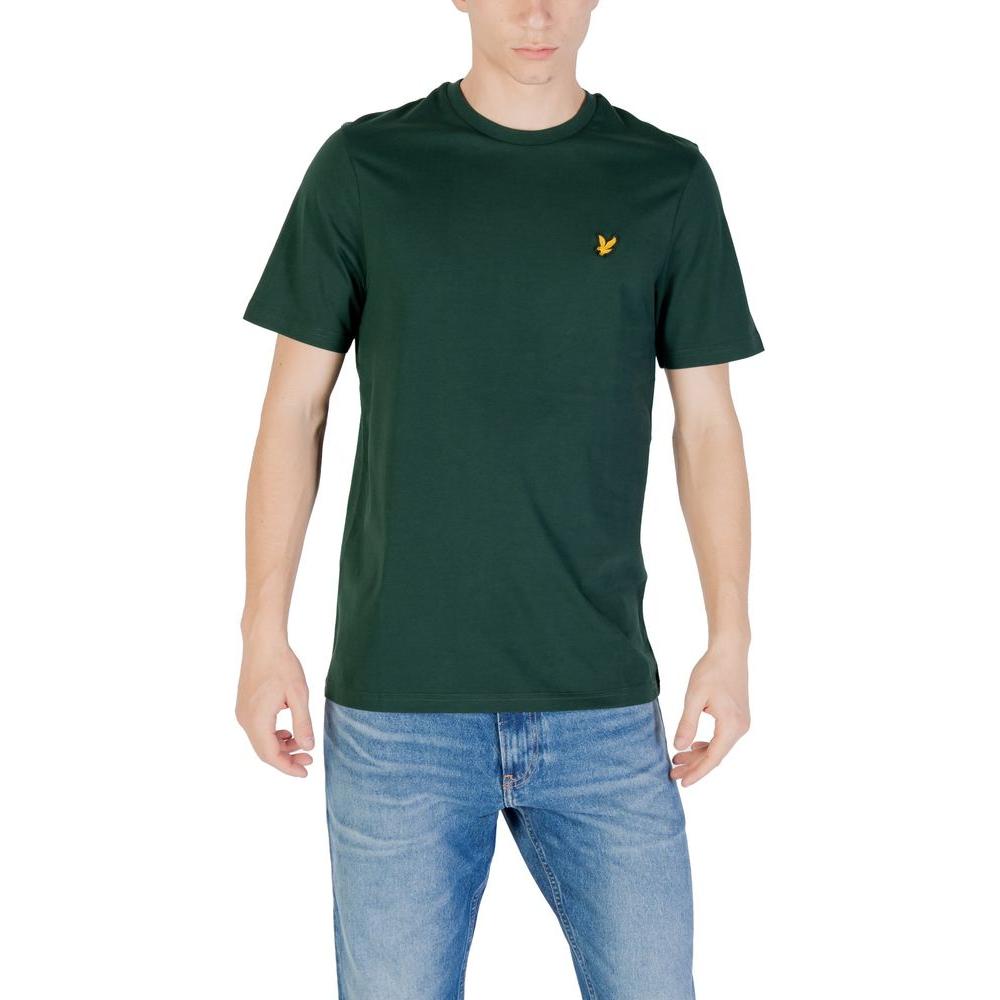 Man wearing Lyle & Scott Green Cotton T-Shirt, short-sleeve, 100% cotton, standing in jeans, showcasing casual style.