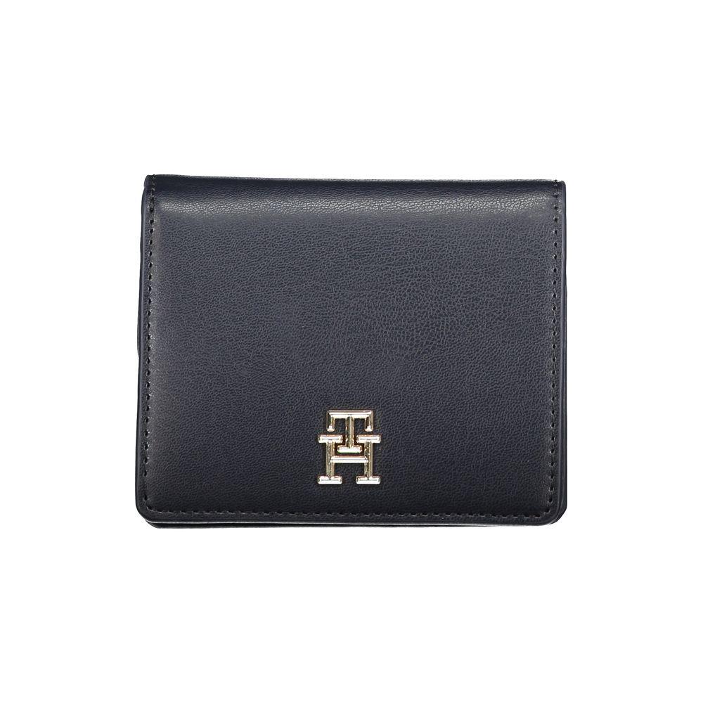 Tommy Hilfiger blue polyethylene wallet with logo, 2 external card pockets, coin purse, card spaces, and snap closure.