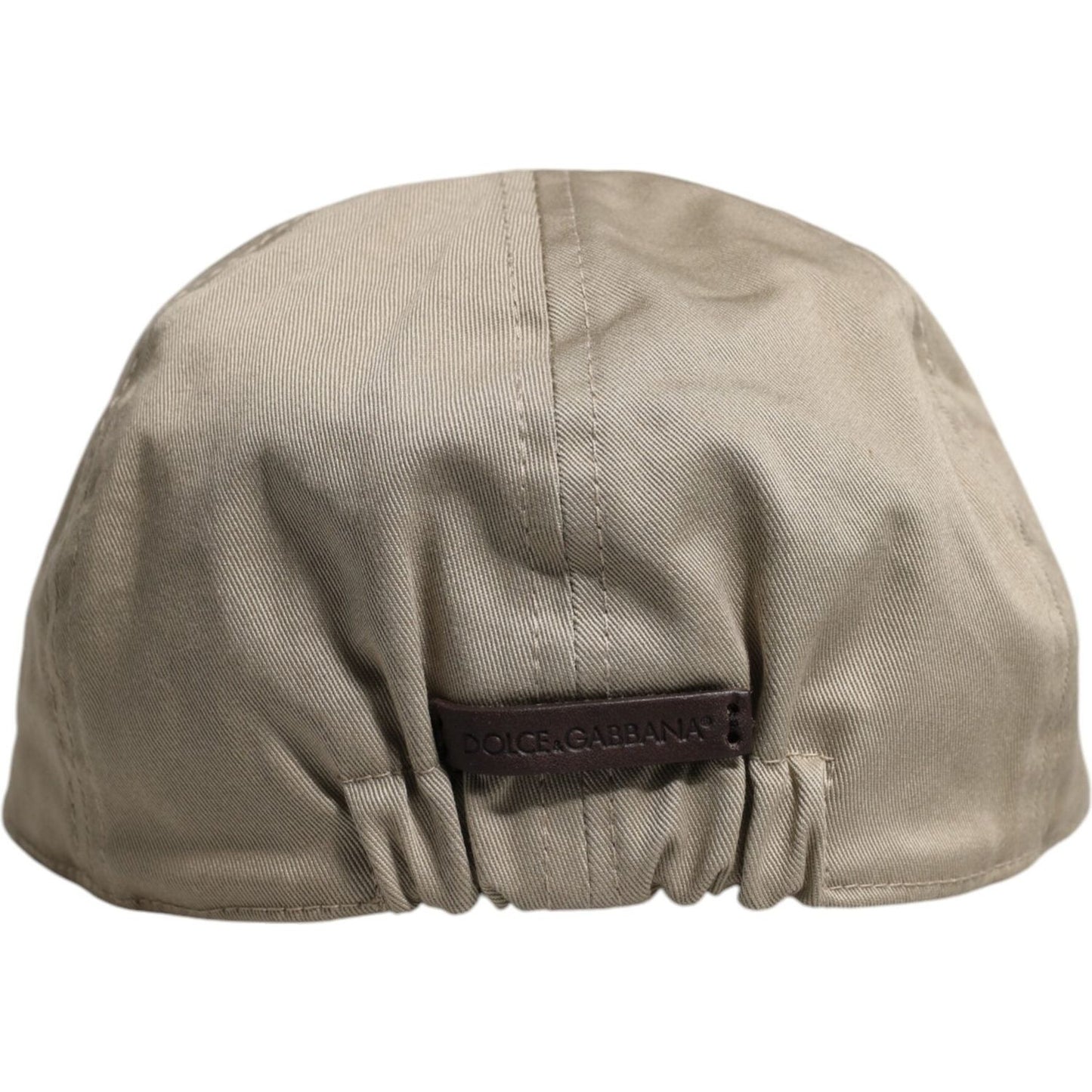 Rear view of Dolce & Gabbana beige newsboy cap in cotton with logo detail, made in Italy, featuring elastic back for fit.