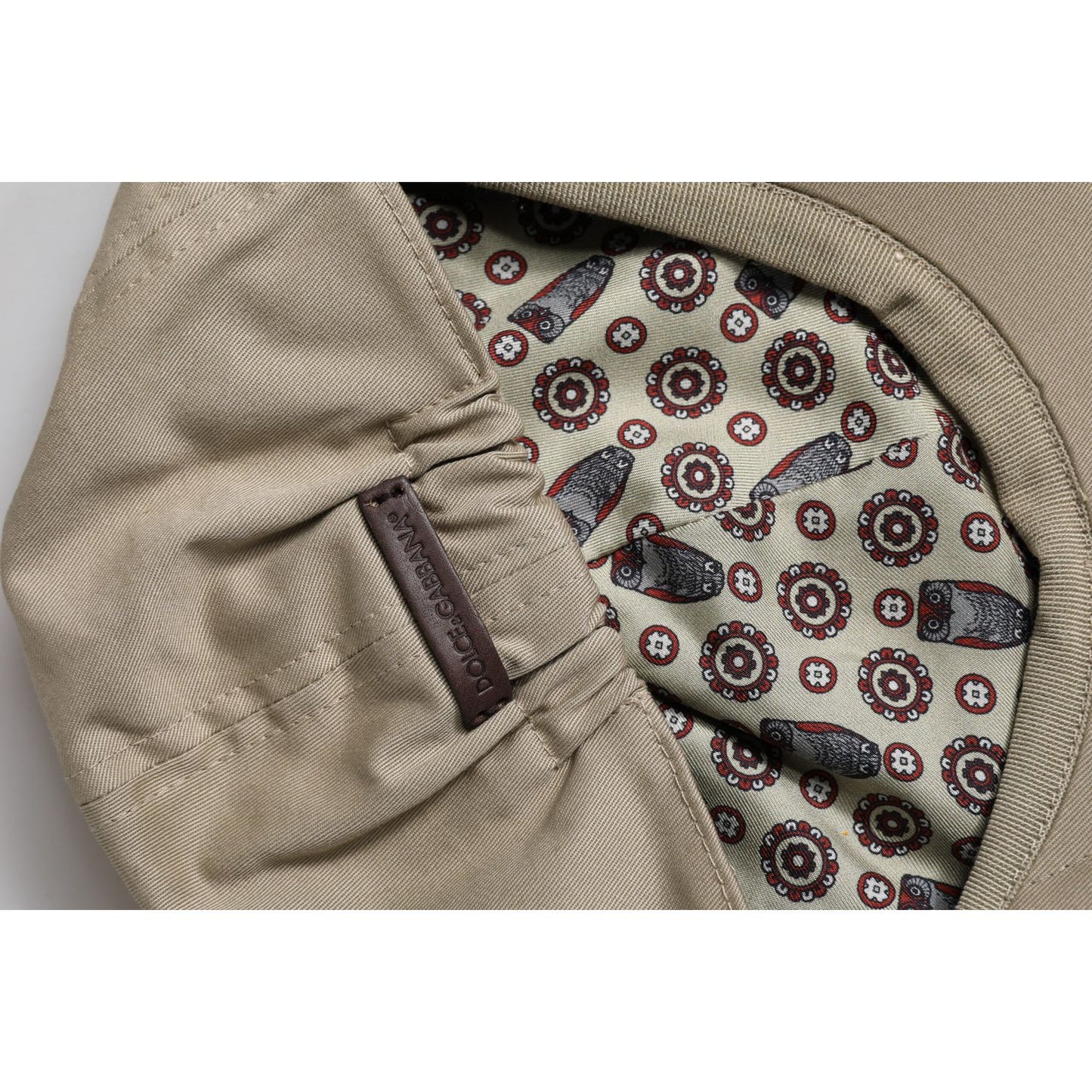 Dolce & Gabbana beige cotton newsboy cap with patterned lining and logo detail inside view