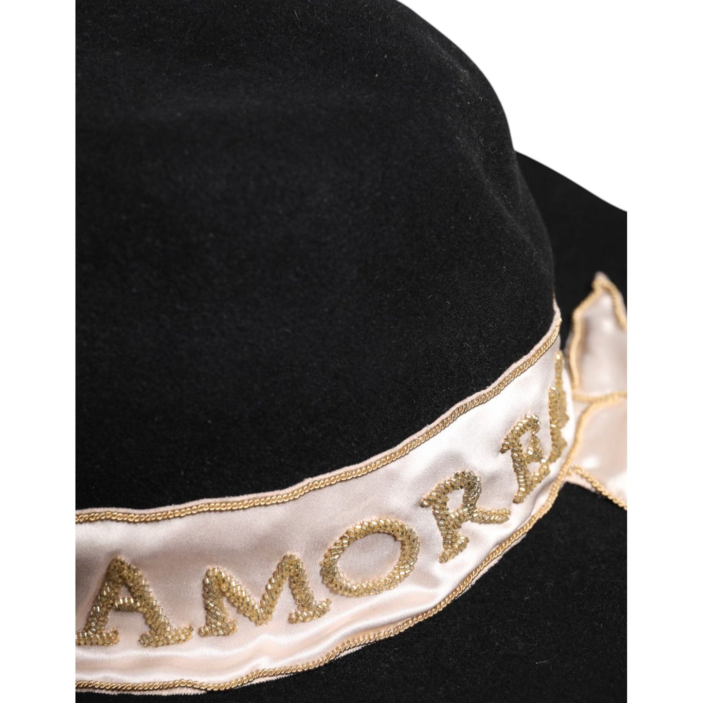 Dolce & Gabbana black wide brim hat with sequin embroidery and logo detail on white band.