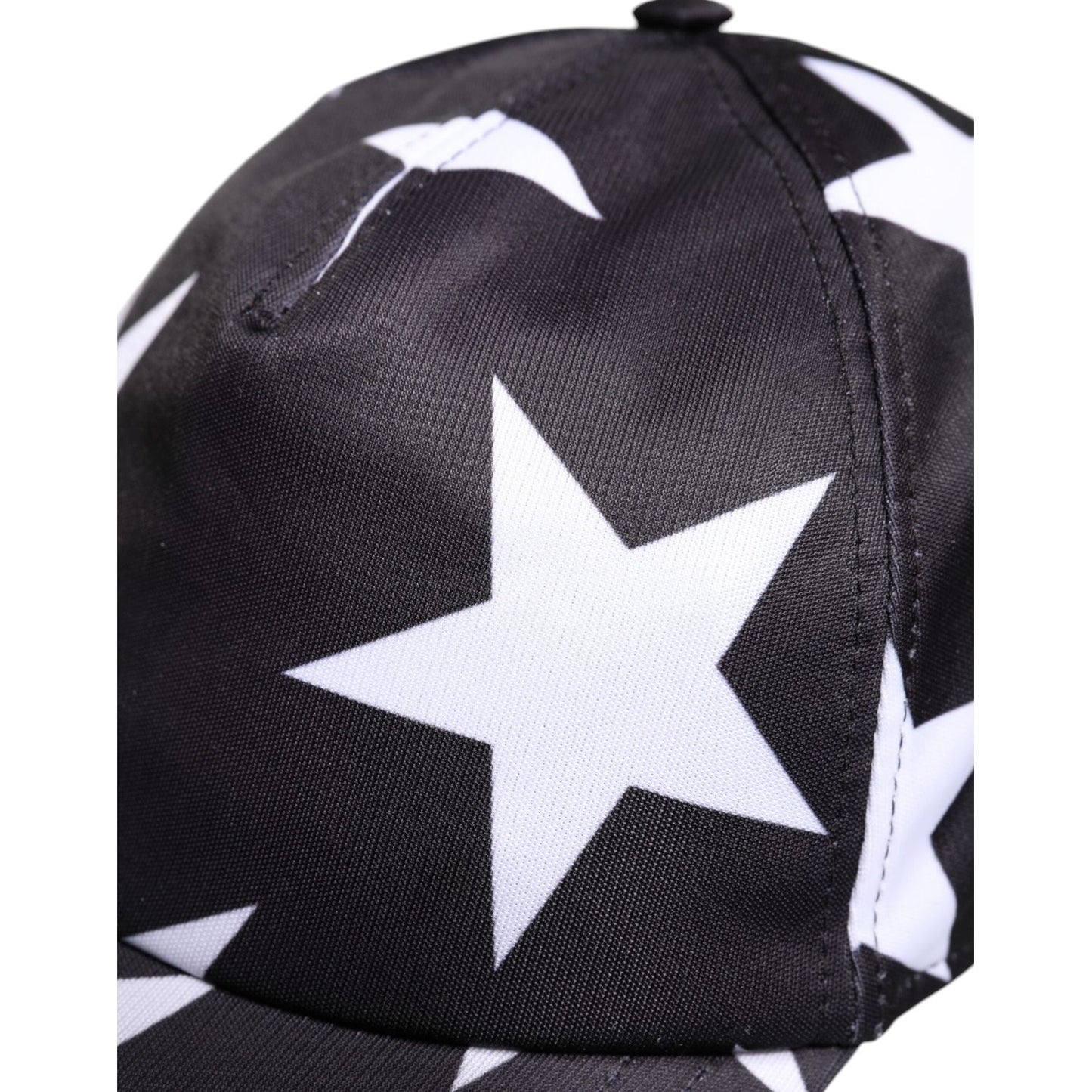 Dolce & Gabbana black polyester baseball cap with white star print, featuring logo details, made in Italy.