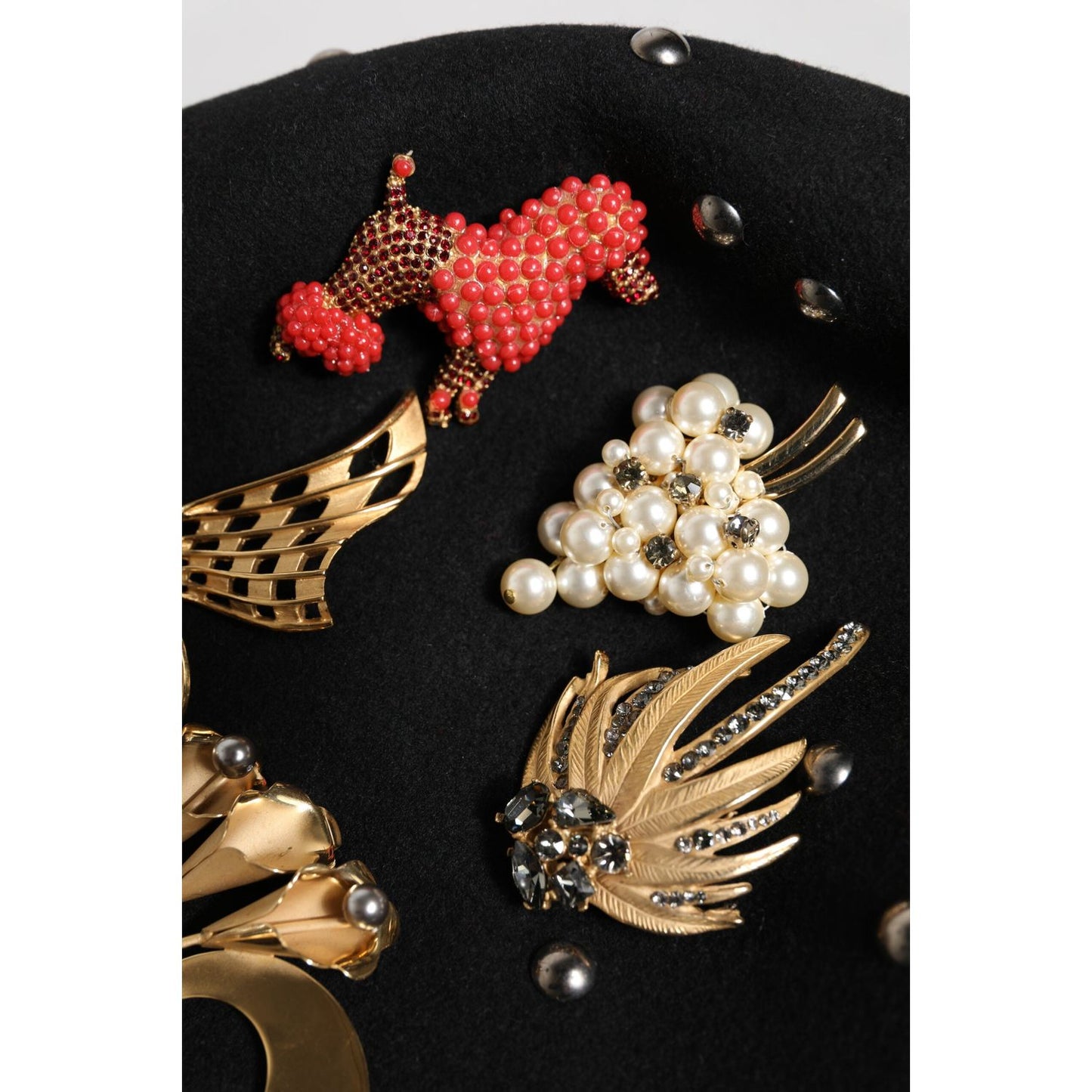 Dolce & Gabbana black wool cloche hat with multicolor crystal, pearl embellishments, and metal detailing, made in Italy.