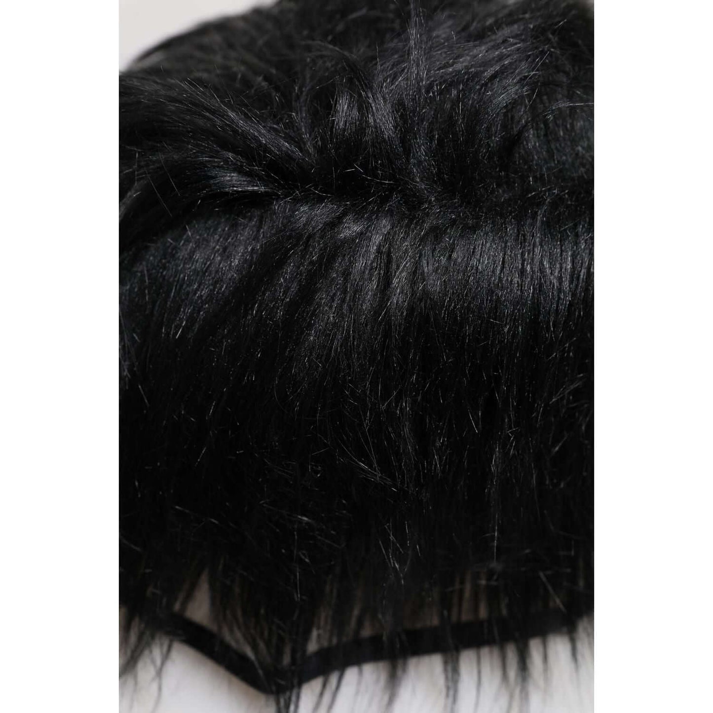 Close-up view of Dolce & Gabbana Black Faux Fur Bucket Hat showcasing soft texture and luxurious faux fur material.