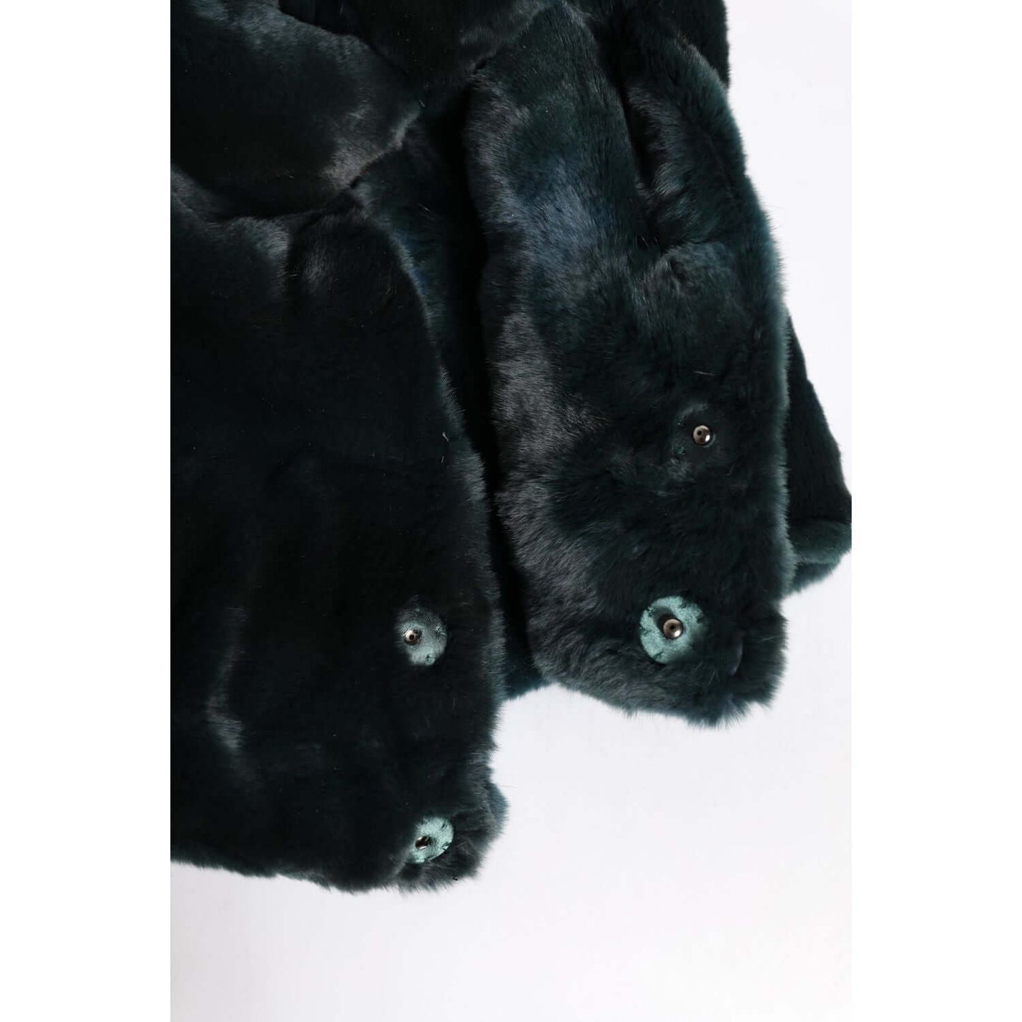 Close-up of Dolce & Gabbana black weasel fur material with detailed texture, showcasing luxurious craftsmanship.