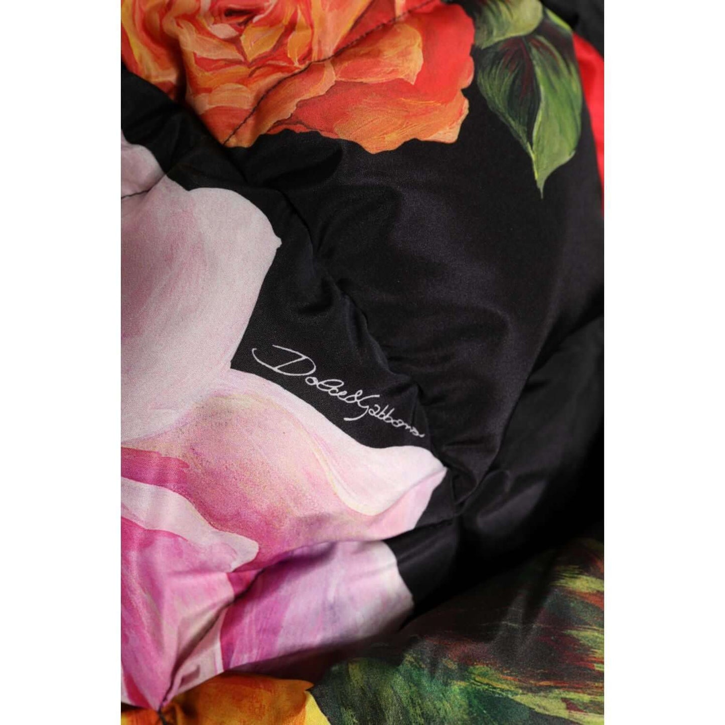 Dolce & Gabbana black floral print head wrap hat with visible logo, featuring vibrant orange and pink flowers, made of 100% polyester.