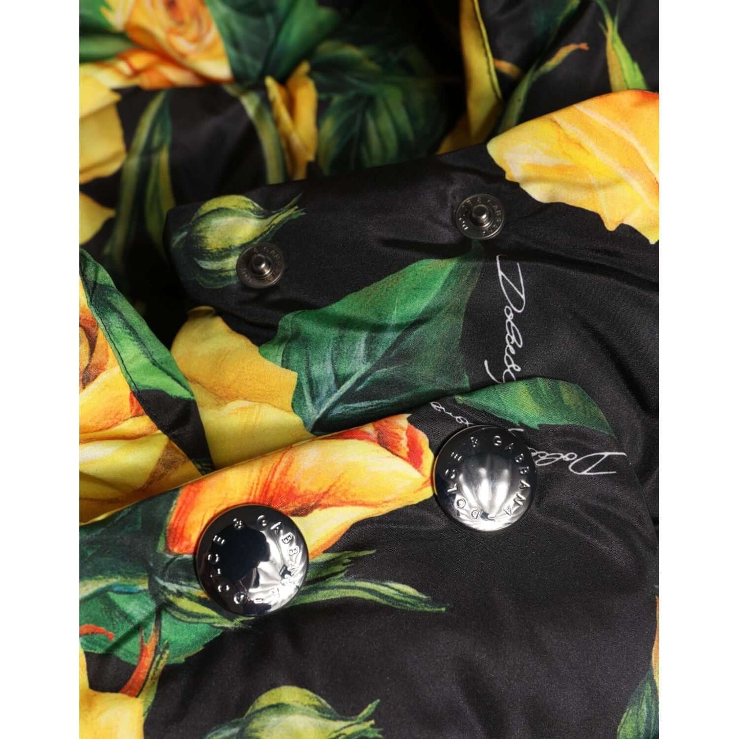 Dolce & Gabbana black floral print head wrap hat with logo details, made of 100% polyester, featuring yellow flowers on black fabric.