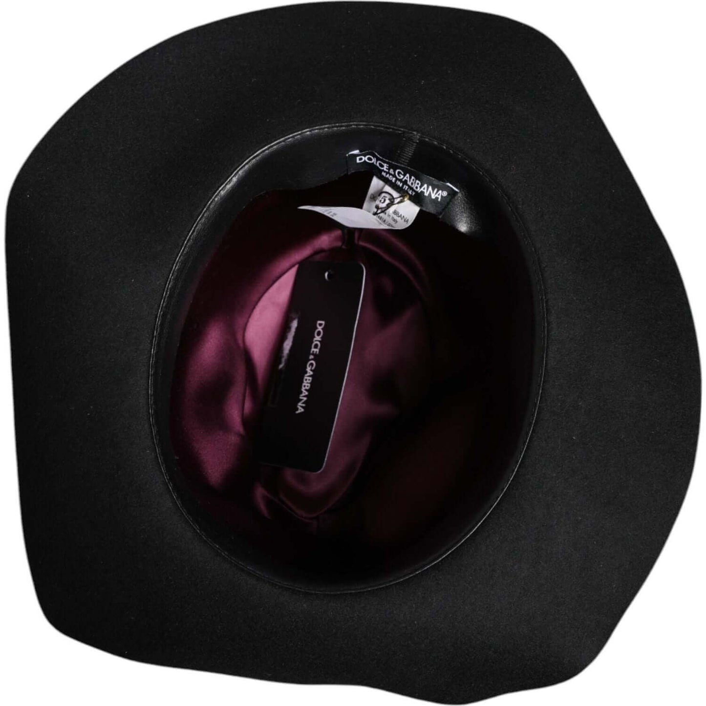 Dolce & Gabbana black trilby fedora hat, interior view with logo tags, showcasing quality Italian craftsmanship.