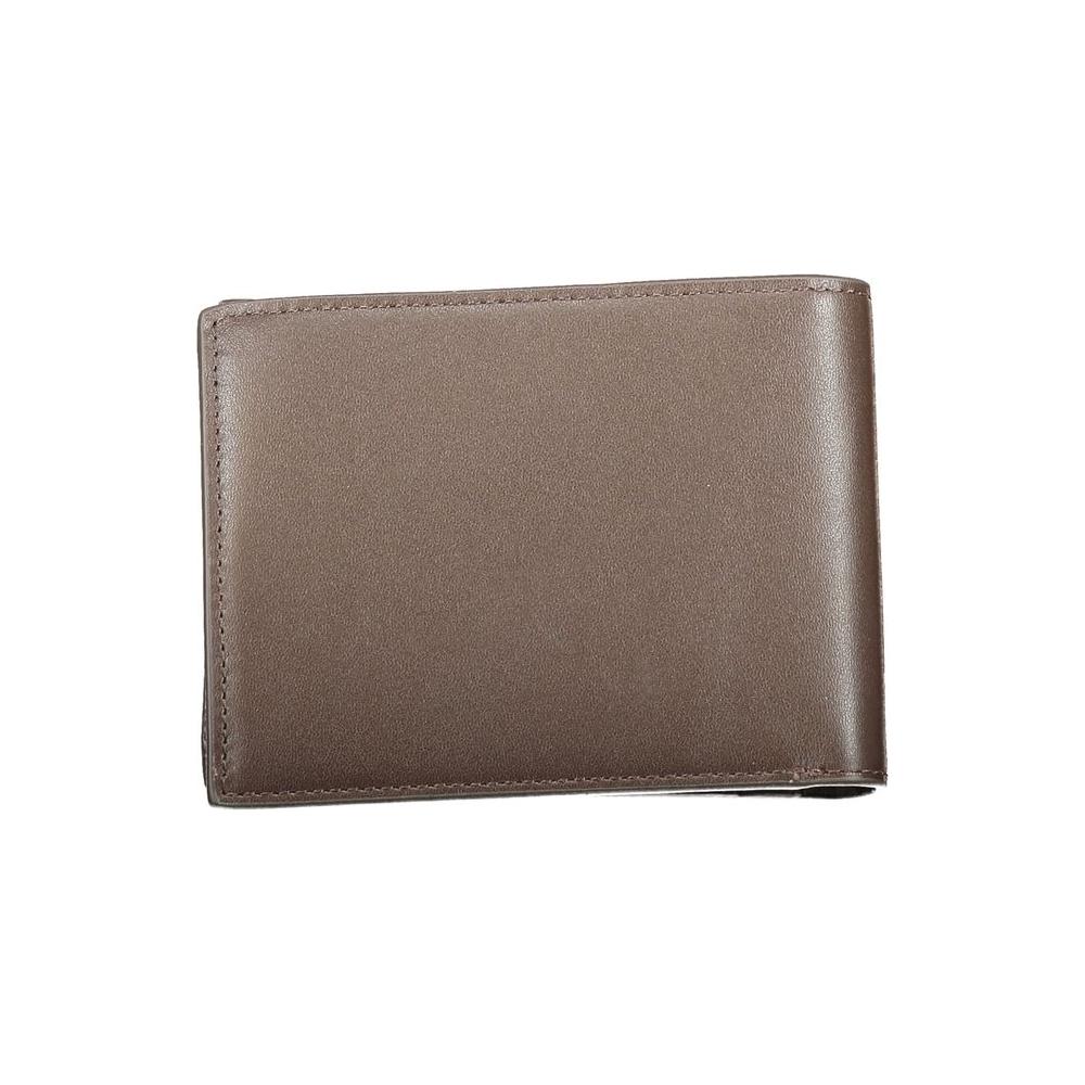 Calvin Klein brown leather wallet with RFID block, featuring two compartments, coin purse, and spaces for cards, displaying logo.