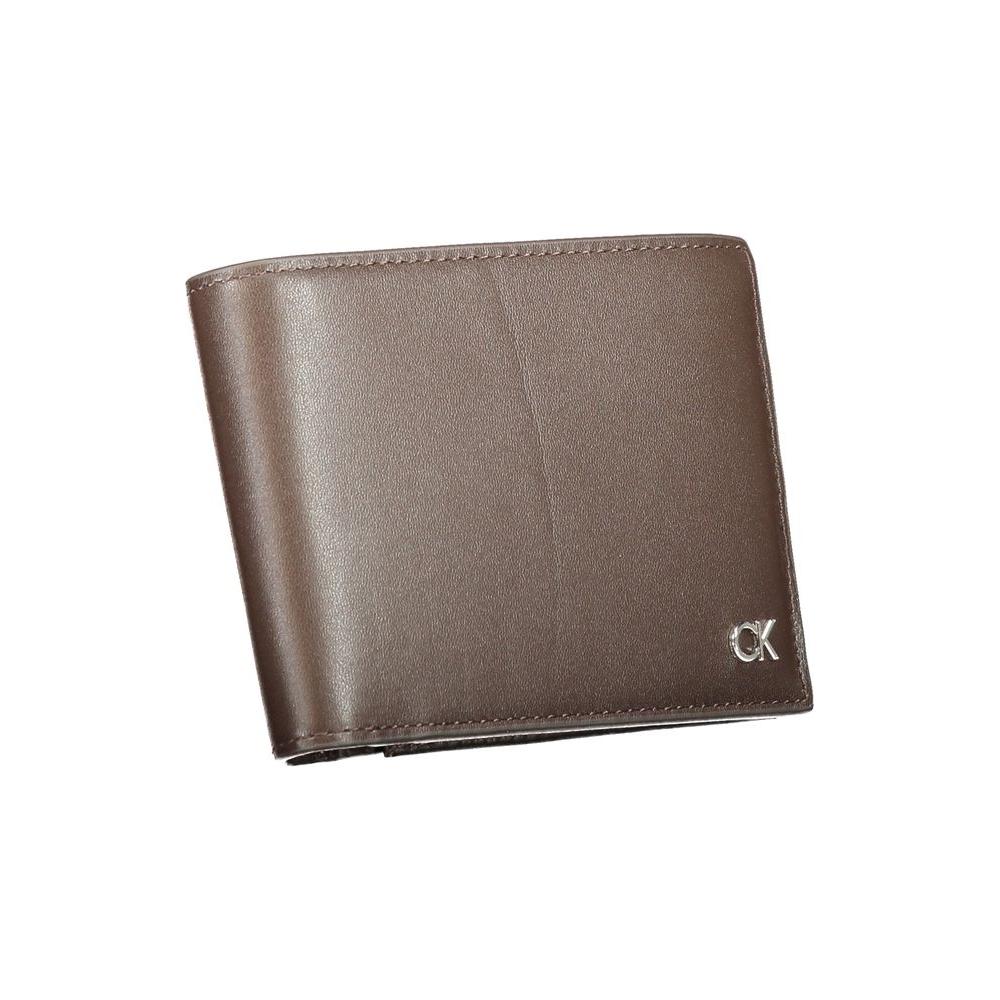 Calvin Klein brown leather wallet with logo, featuring 2 compartments, coin purse, card slots, and RFID block for security.